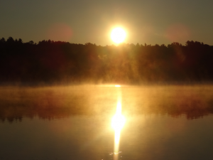 foggy sunrise on like